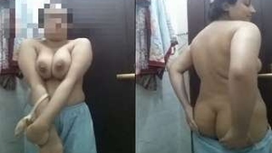 Busty babe flaunts her curves in a tantalizing video