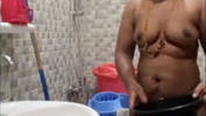 Tamil Auntie's intimate bathing session captured on camera
