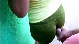 A girl wearing spandex performs an anal sex act