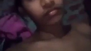 A youthful girl indulging in self-pleasure