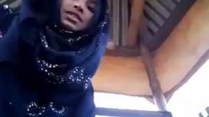 Young hijabi beauty shows off her alluring pussy