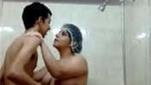 Aunty with large breasts gets oral pleasure from fortunate young man in the shower