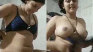 Attractive bhabhi flaunts her breasts and vagina