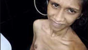 A thin Sri Lankan girl with small breasts bathes
