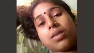 A seductive wife reveals her breasts and stimulates herself with her fingers