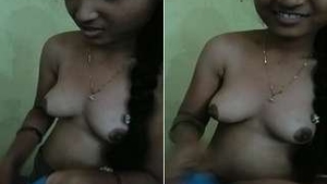 After sex, a cute girl wears a top
