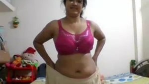 Indian girlfriend strips down to reveal her body in pink lingerie