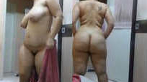 Elderly Indian aunt's voluptuous rear end