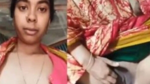 Married Indian woman sensually reveals her breasts and intimate area