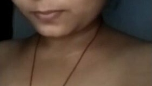 An enticing Indian girl proudly displays her voluptuous bust