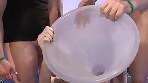 Girl gets pee through a large funnel