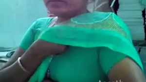 A mature colleague fondles her bossy's ample bosom in the workplace