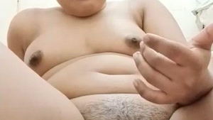 Watch as a bhabi masturbates and cums on her finger in the bathroom