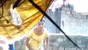 Indian beauty bathes outdoors in the sun