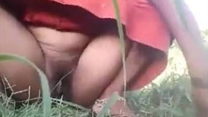 Watch a woman from a Telugu village pee in the outdoors