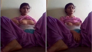 Horny Indian teen masturbates in purple outfit