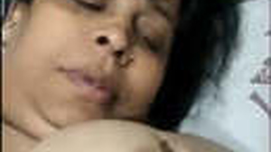 Indian wife flaunts her large breasts in front of the camera