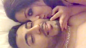 Young couple enjoys passionate sex on the bed in bedroom