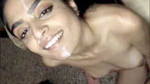 Indian beauty gives a blowjob and receives a facial from her partner's balls