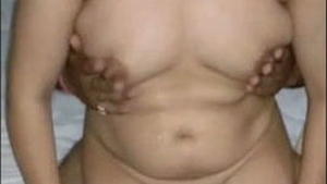 Indian aunty's big boobs in steamy video