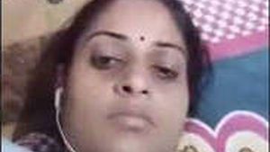 Horny Bhabi fondles her breasts during a video call