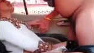 Busty babe gives a blowjob and gets fucked in the car