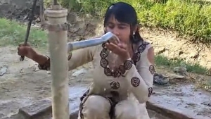 Cute girl takes a sexy outdoor bath in front of cam