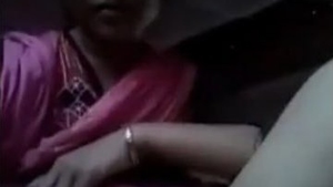 A South Asian woman undresses and exposes her genitals in this erotic recording