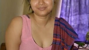 A South Asian wife with large breasts stimulates her husband and he ejaculates on her face