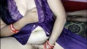 Aroused wife in a nightgown opens her legs and stimulates herself