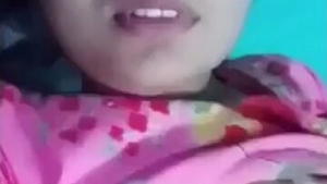 A charming and alluring Indian girl entices with her display