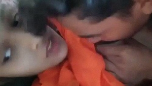Indian teenage lovers enjoy steamy sex on the couch with titjob