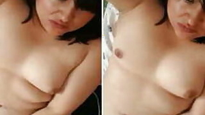 Aroused Desi woman fingers her XXX muff and captures process on cam