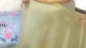 Indian mom comes home and changes clothes flashing boobs in sex video