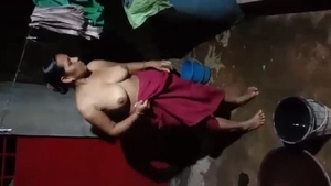 Indian village wife takes evening bath