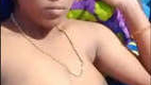 Watch a Tamil bhabhi flaunt her breasts and pussy in a steamy video