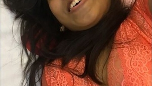 Indian girl pleasures herself while speaking and sucking her fingers