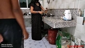 A sultry encounter between a black wife and her lover in the kitchen