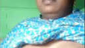 A mature woman in the village flaunts her large breasts