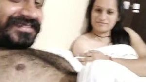 Passionate couple engages in intimate acts in a hotel room