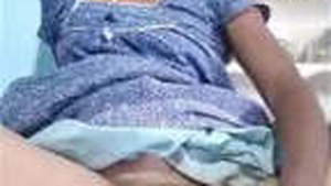 Aroused Indian wife pleasuring herself with a large banana