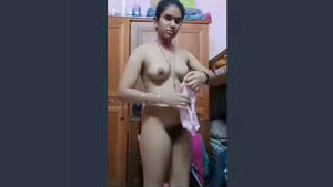 Busty Indian babe strips and changes into sexy lingerie