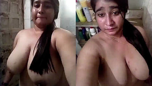 A seductive Indian girl performs a sensual striptease for the camera
