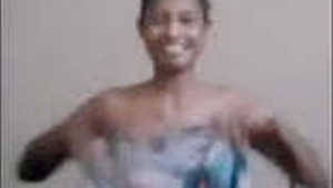 A Sri Lankan woman proudly displays her large breasts