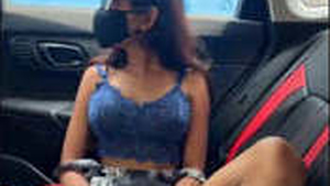 Stunning woman exposes her intimate areas while riding a car